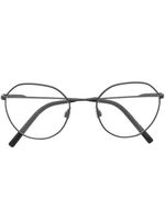 Dolce & Gabbana Eyewear lunettes de vue à monture ronde transparente - Noir - thumbnail