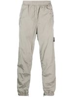 Stone Island pantalon de jogging à motif Compass - Gris