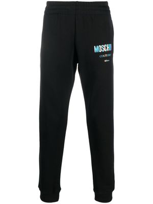 Moschino pantalon de jogging à logo imprimé - Noir