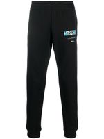 Moschino pantalon de jogging à logo imprimé - Noir