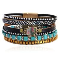Deja Boho Armband goudkleurig met turquoise kralen en kruis natuursteen in zwart met print