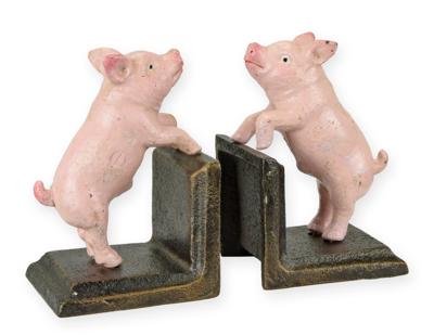 A PAIR OF CAST IRON PIG BOOKENDS