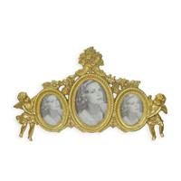 A RESIN TRIPLE PHOTO FRAME FLANKED BY PUTTI