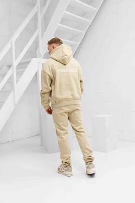 Cou7ure Essentials Rubber Trainingspak Heren Beige - Maat M - Kleur: Beige | Soccerfanshop