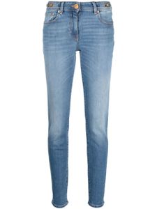 Versace jean skinny à taille basse - Bleu