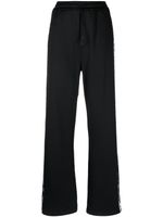 DSQUARED2 pantalon de jogging ample à bandes logo - Noir