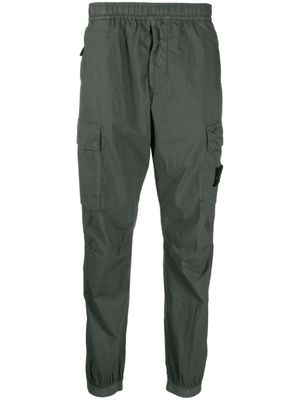 Stone Island pantalon cargo à motif Compass signature - Vert