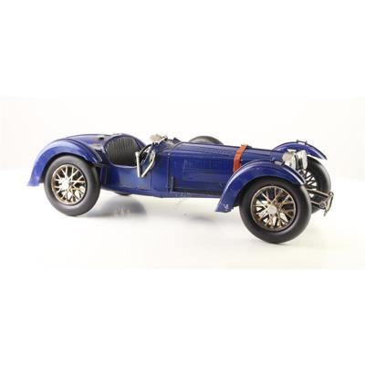 A TIN MODEL OF A CLASSIC RACE CAR