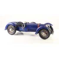 A TIN MODEL OF A CLASSIC RACE CAR