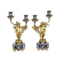 A PAIR OF BRONZE MOUNTED TWO BRANCH PORCELAIN CANDELABRA