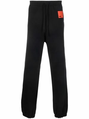 OAMC pantalon de jogging en coton à patch logo - Noir