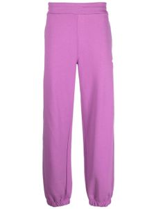 MSGM pantalon de jogging en coton à logo imprimé - Violet