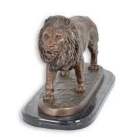 A BRONZE SCULPTURE OF A LION A BRONZE SCULPTURE OF A LION