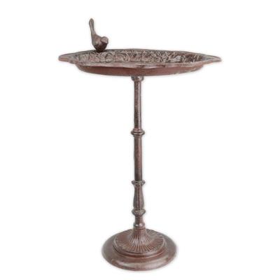 A CAST IRON BIRD BATH ON BASE