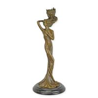 A FIGURAL BRONZE CANDLESTICK