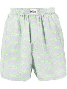 Natasha Zinko short à slogan imprimé all-over - Gris