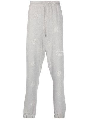Martine Rose pantalon de jogging à motif monogrammé - Gris