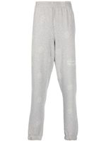 Martine Rose pantalon de jogging à motif monogrammé - Gris