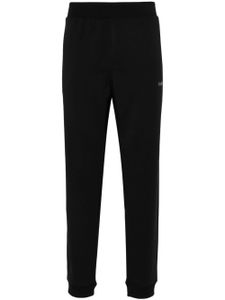 Calvin Klein pantalon de jogging à logo texturé - Noir