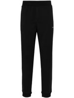 Calvin Klein pantalon de jogging à logo texturé - Noir