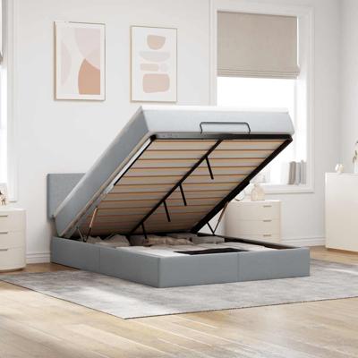 Ottoman bed met matras en LED's 140x200cm stof lichtgrijs