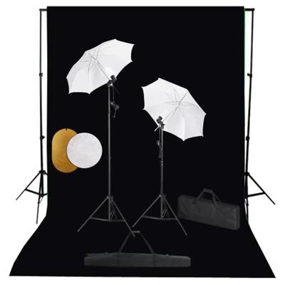 Fotostudioset met lampen, paraplu's, achtergrond en reflector