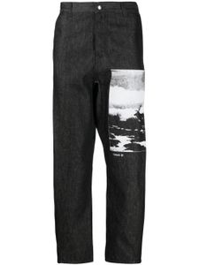 OAMC pantalon en coton biologique à imprimé graphique - Noir