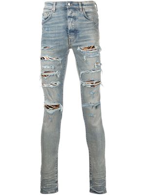 AMIRI jean MX1 skinny à effet usé - Bleu
