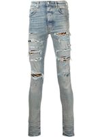 AMIRI jean MX1 skinny à effet usé - Bleu
