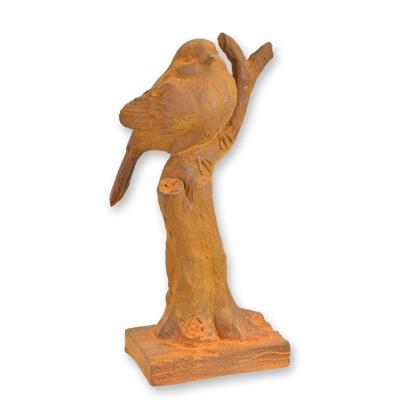 A RUSTY CAST IRON FIGURINE OF A SPARROW ON BRANCH