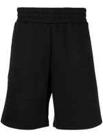 Moschino short à motif monogrammé - Noir