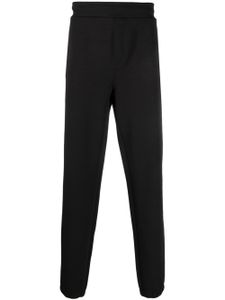 Calvin Klein pantalon de jogging à logo embossé - Noir