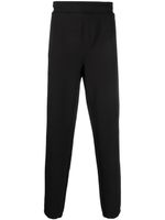 Calvin Klein logo-debossed track pants - Noir