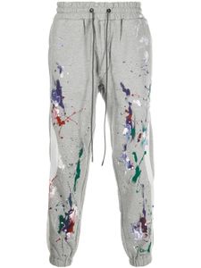 Mostly Heard Rarely Seen pantalon de jogging fuselé à effet taches de peinture - Gris