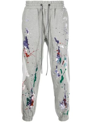Mostly Heard Rarely Seen pantalon de jogging fuselé à effet taches de peinture - Gris