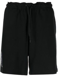 Yohji Yamamoto short en coton à logo imprimé - Noir