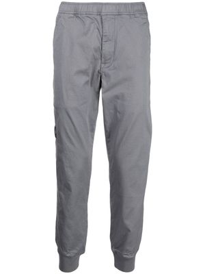 AAPE BY *A BATHING APE® pantalon fuselé à logo imprimé - Gris