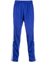 adidas pantalon de jogging à détails rayés - Bleu