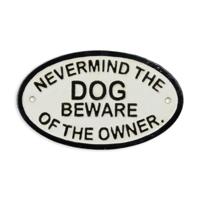 A CAST IRON "NEVERMIND THE DOG, BEWARE OF THE OWNER" PLAQUE