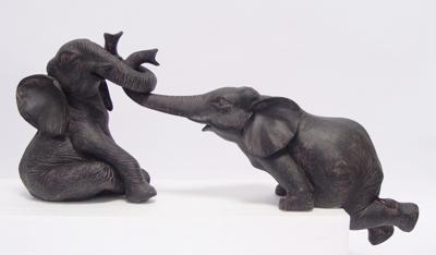 A PAIR OF RESIN ELEPHANTS