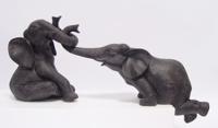 A PAIR OF RESIN ELEPHANTS