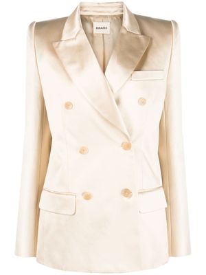 KHAITE blazer en satin Nathan à boutonnière croisée - Tons neutres