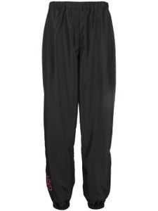 GCDS pantalon de jogging à logo imprimé - Noir