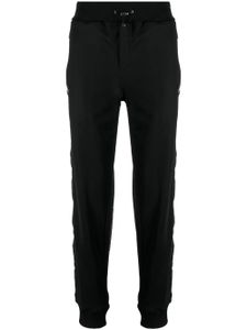 Philipp Plein pantalon de jogging à boutons gravés - Noir