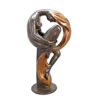 A BRONZE SCULPTURE OF A SITTING WOMAN WITH LONG HAIR