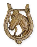 A CAST IRON HORSESHOE DOOR KNOCKER