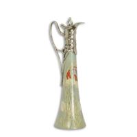 A BRONZE MOUNTED PORCELAIN CLARET JUG - SILVER PLATED A BRONZE MOUNTED PORCELAIN CLARET JUG - SILVER PLATED