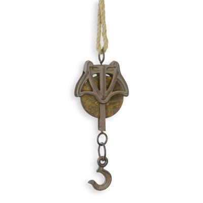 A CAST IRON PULLEY ON ROPE