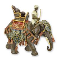 A BRONZE SCULPTURE OF A DECORATED ELEPHANT AND RIDER