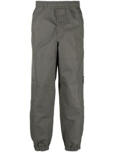 Stone Island pantalon fuselé en coton à motif Compass - Gris